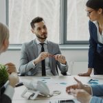 Business professionals collaborating around a conference table
