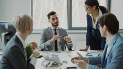 Business professionals collaborating around a conference table